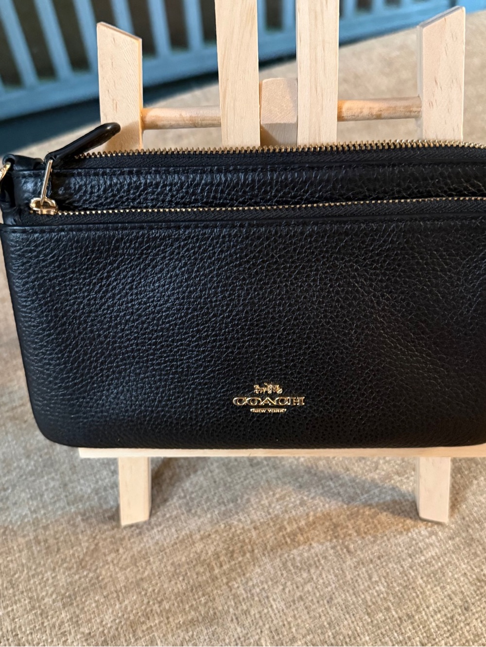 Coach Double Zip Wristlet crafted in black pebbled leather
